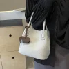 le petit sac élégant est un sac à bandoulière polyvalent pour les femmes et un sac seau à main super populaire