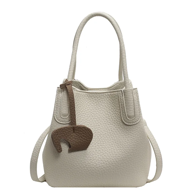 Le petit sac élégant est un sac à bandoulière polyvalent pour les femmes et un sac seau à main super populaire Le petit sac élégant est un sac à bandoulière polyvalent pour les femmes et un sac seau à main super populaire