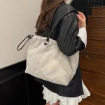 Sac cartable à la mode pour femmes avec pompon en cuir pu, sac à bandoulière pour le travail et le bureau, printemps 2025