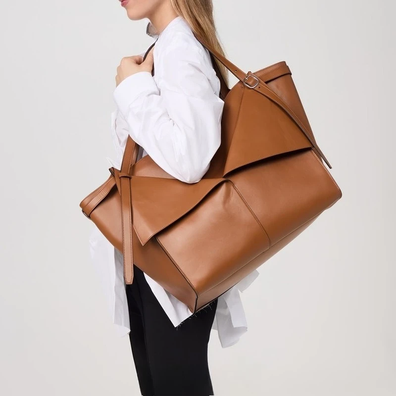 Sac fourre-tout de grande capacité de petit Design 2025, sac seau d’eau Simple européen et américain, sac à bandoulière à une épaule pour femmes Sac fourre-tout de grande capacité de petit Design 2025, sac seau d’eau Simple européen et américain, sac à bandoulière à une épaule pour femmes