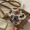 sac seau blanc pour femme avec motif floral vibrant, fermeture à cordon réglable, bandoulière/sac à main convertible doublé en polyester