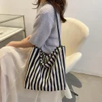 Femme décontracté multifonctionnel voyage poignée supérieure sac à main grande capacité toile femmes Shopper fourre-tout Simple rayé sac à bandoulière 2025