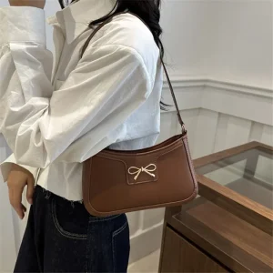 Sac à bandoulière élégant avec décoration de nœud en métal, sac sous les bras polyvalent, sac Baguette classique marron et noir pour femmes, usage quotidien