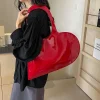 ins style – sac à main brillant en forme de cœur, couleur unie, design concave d'été en cuir verni rouge, sac à bandoulière à la mode, 2024