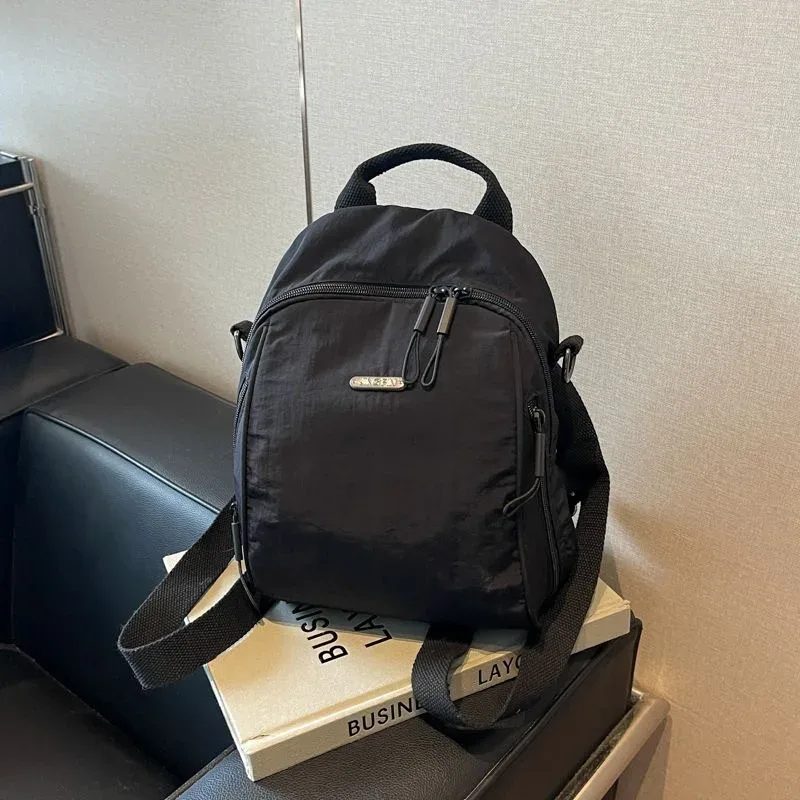 mini sac à dos multifonctionnel en nylon, sac de voyage convertible décontracté à bandoulière pour femme, sac à dos quotidien multi-poches pour l'extérieur