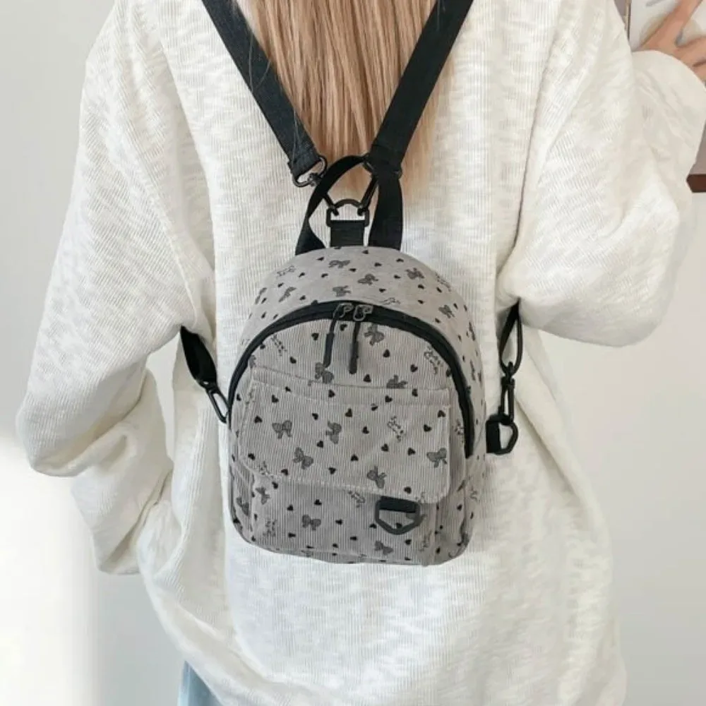 mini sac à dos en velours côtelé léger avec imprimé cœur et nœud, sac à dos décontracté multi-compartiments à ouverture zippée, sac à bandoulière de voyage