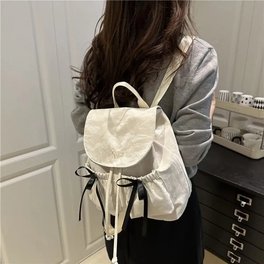 sac à dos à nœud mignon pour femmes, sac à dos avec cordon de serrage de grande capacité pour étudiants, sac de voyage de couleur unie pour l'extérieur