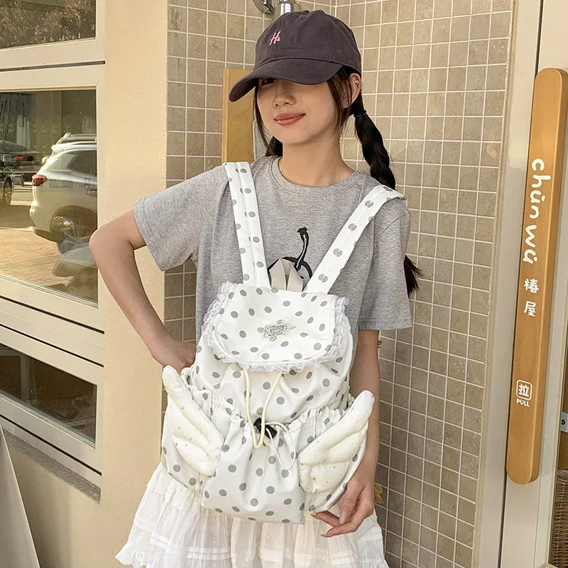 sac à dos pour étudiants à cordon de serrage avec motif ailes d'ange et pois, sac d'école coréen mignon et élégant en nylon, sac de voyage léger et spacieux
