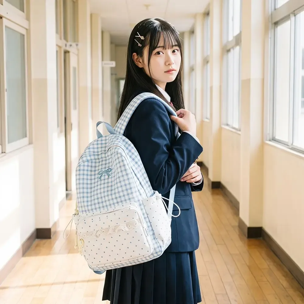 sac à dos tendance à pois, avec nœud, minimaliste, léger, grande capacité, bordure en dentelle, idéal pour les trajets quotidiens.