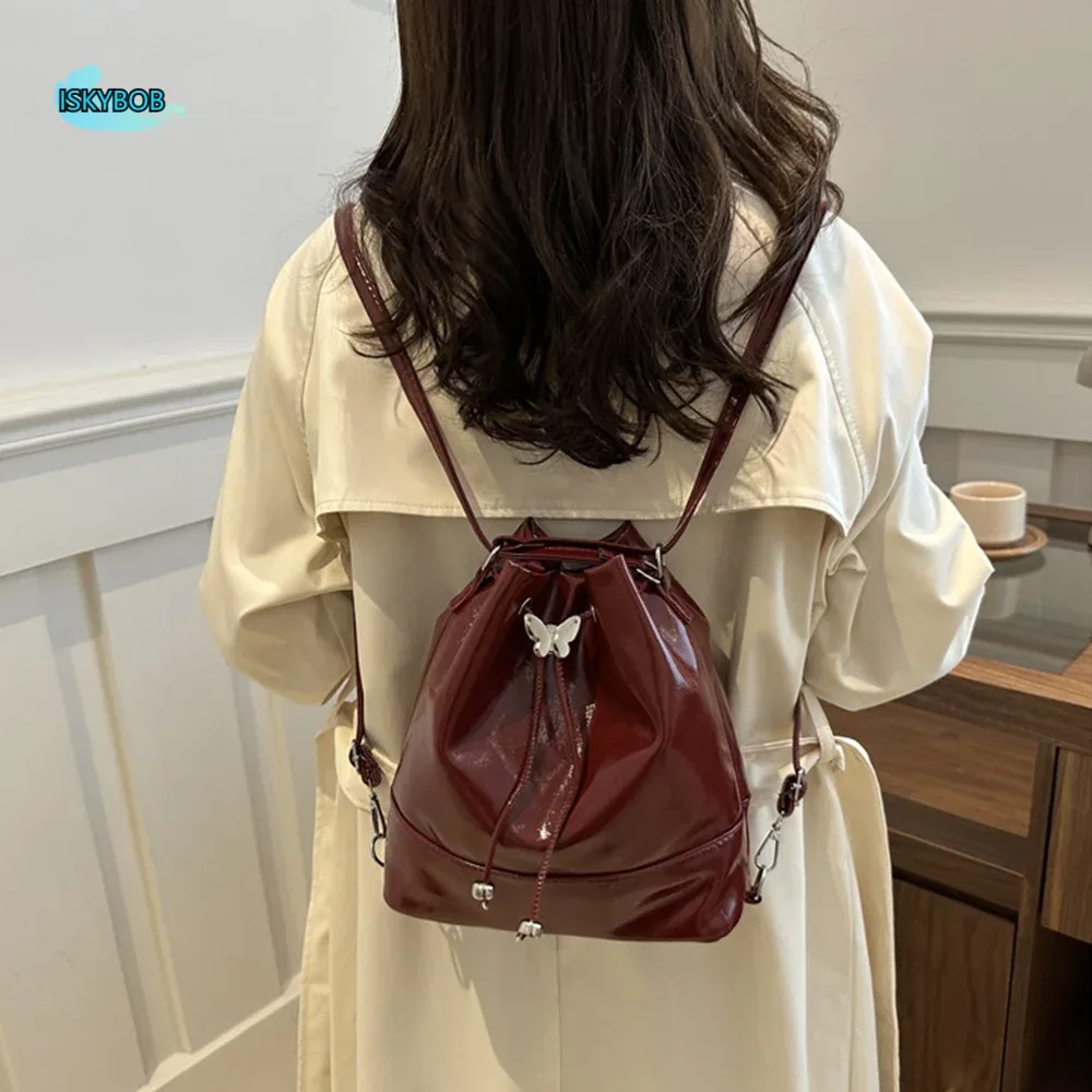 Sac à dos tendance style preppy en PU avec nœud, sac seau à cordon de serrage pour loisirs, sac à bandoulière simple de couleur unie pour filles