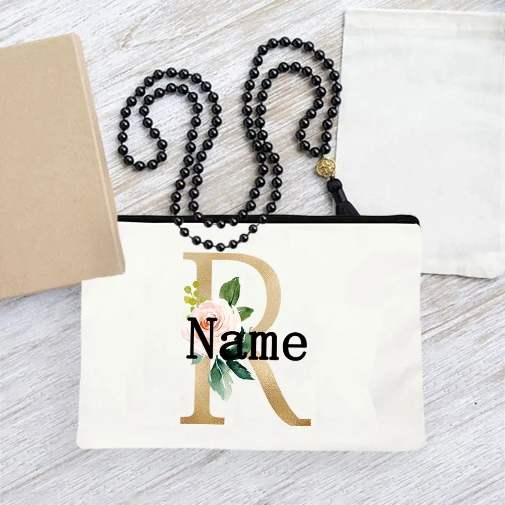 pochette en toile personnalisée avec initiales florales dorées, trousse de toilette légère personnalisée avec monogramme pour femmes, idéale pour les voyages quotidiens.