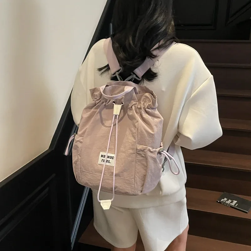 sac en toile polyvalent de grande capacité, décontracté, nouvelle mode d'été 2025, sac à dos à cordon de serrage, concis, couleur unie, sacs d'école légers