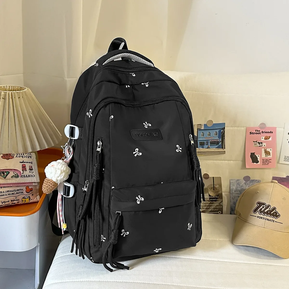 sac à dos traveasy 2026 nouveau motif nœud mignon polyvalent en nylon avec pendentif pompon protection dorsale pour étudiants