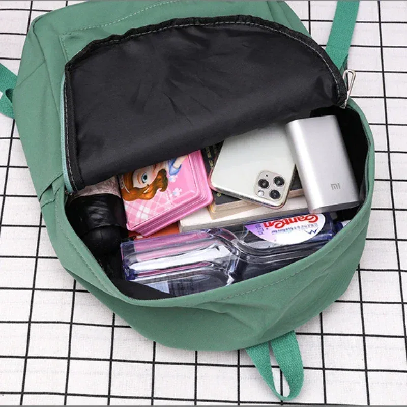 haute qualité nouveau imperméable à l'eau en nylon femmes sac à dos femme sac de voyage sacs à dos cartable pour adolescentes couleur unie bookbag