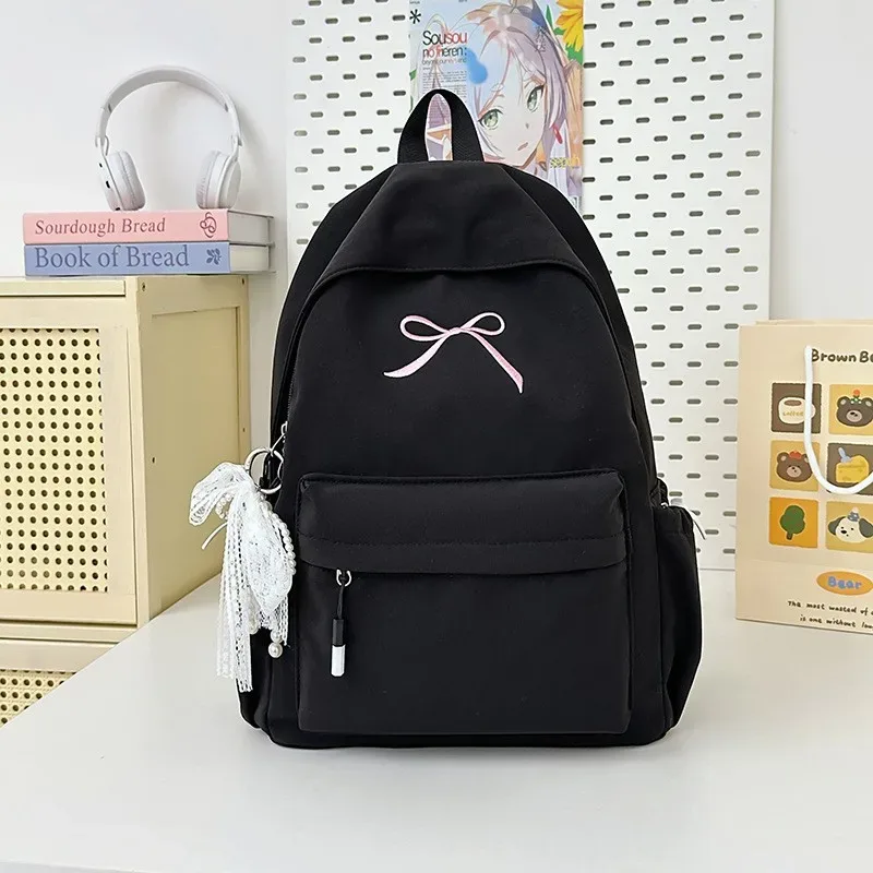 sac à dos portable brodé avec nœud pour filles, sac d'école en nylon de couleur unie pour étudiants, sac à dos de voyage léger de grande capacité pour femmes