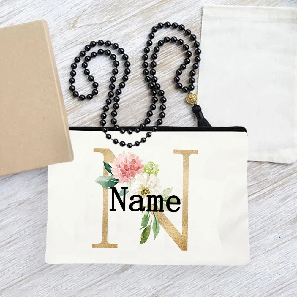 pochette en toile personnalisée avec initiales florales dorées, trousse de toilette légère personnalisée avec monogramme pour femmes, idéale pour les voyages quotidiens.