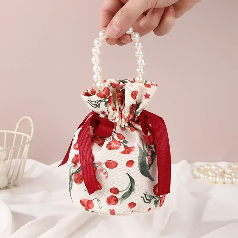 sac à cordon en toile florale, petite pochette à bijoux avec nœud papillon avec poignée en chaîne de perles, sac d'emballage de bonbons de mariage