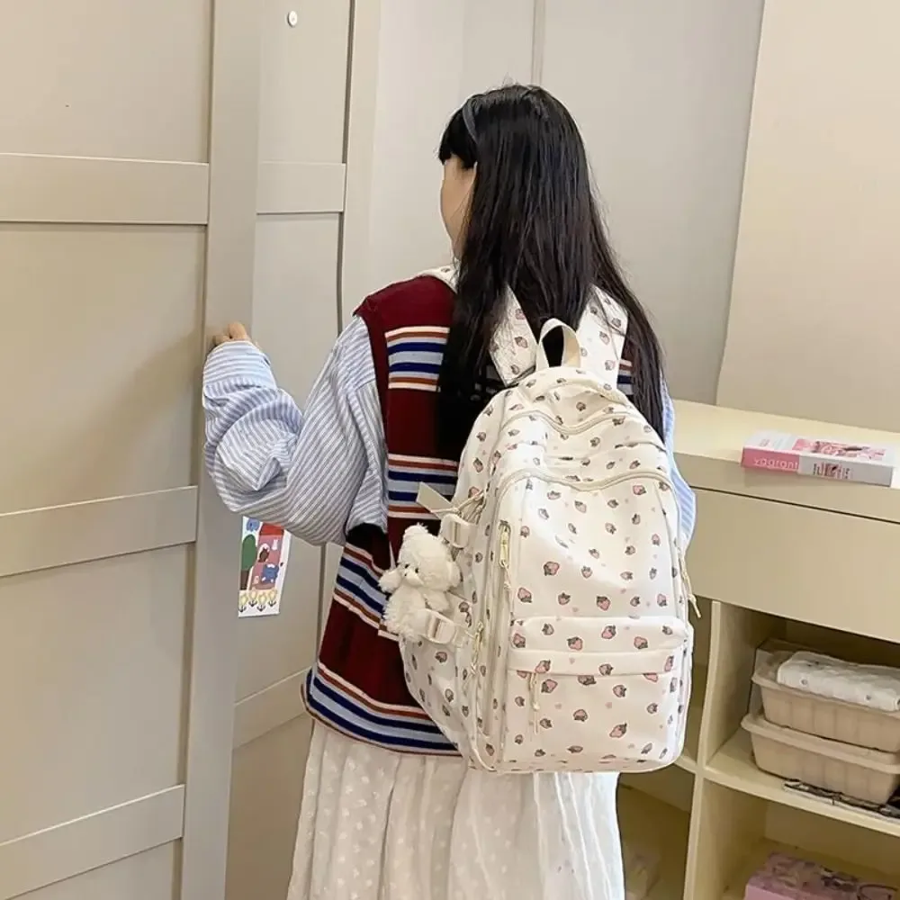 sac d'école en nylon pour étudiants, sac à dos de grande capacité de style preppy pour femmes avec pendentif, sac à dos de voyage à motif floral