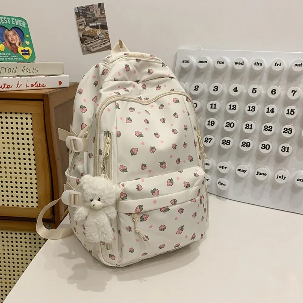 sac d'école en nylon pour étudiants, sac à dos de grande capacité de style preppy pour femmes avec pendentif, sac à dos de voyage à motif floral