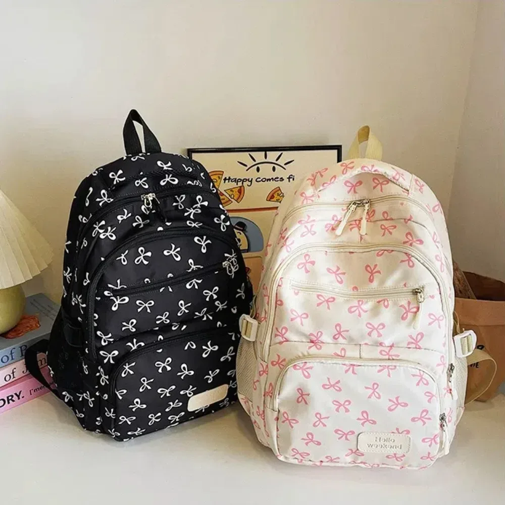 Lot de 3 sacs à dos mignons grande capacité avec nœud, imprimé nœud, bretelles réglables, sac à dos d'étudiant en nylon, sac à dos de voyage