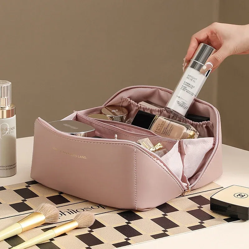 trousse de maquillage pratique et à la mode en pu, sac de rangement de voyage, trousse de toilette de grande capacité, trousse de maquillage pour oreiller de beauté stimulant les mains