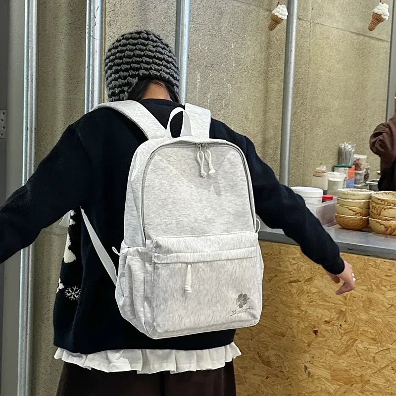 sac à dos noir minimaliste pour femmes, sac d'école décontracté avec broderie florale pour étudiants, utilisation quotidienne, voyage