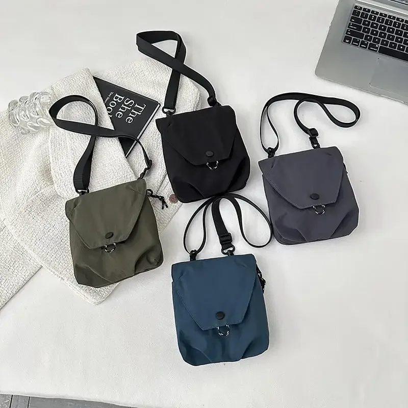 1 sac à bandoulière portable unisexe en tissu nylon imperméable, sac à bandoulière décontracté pour téléphone, idéal pour les voyages.