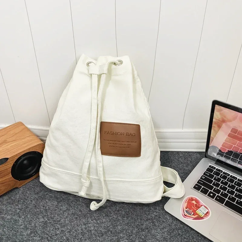 sac d'école solide décontracté, sac à dos en toile à la mode, sac à dos de grande capacité pour les déplacements, sac de voyage pour étudiants, nouvelle collection 2026