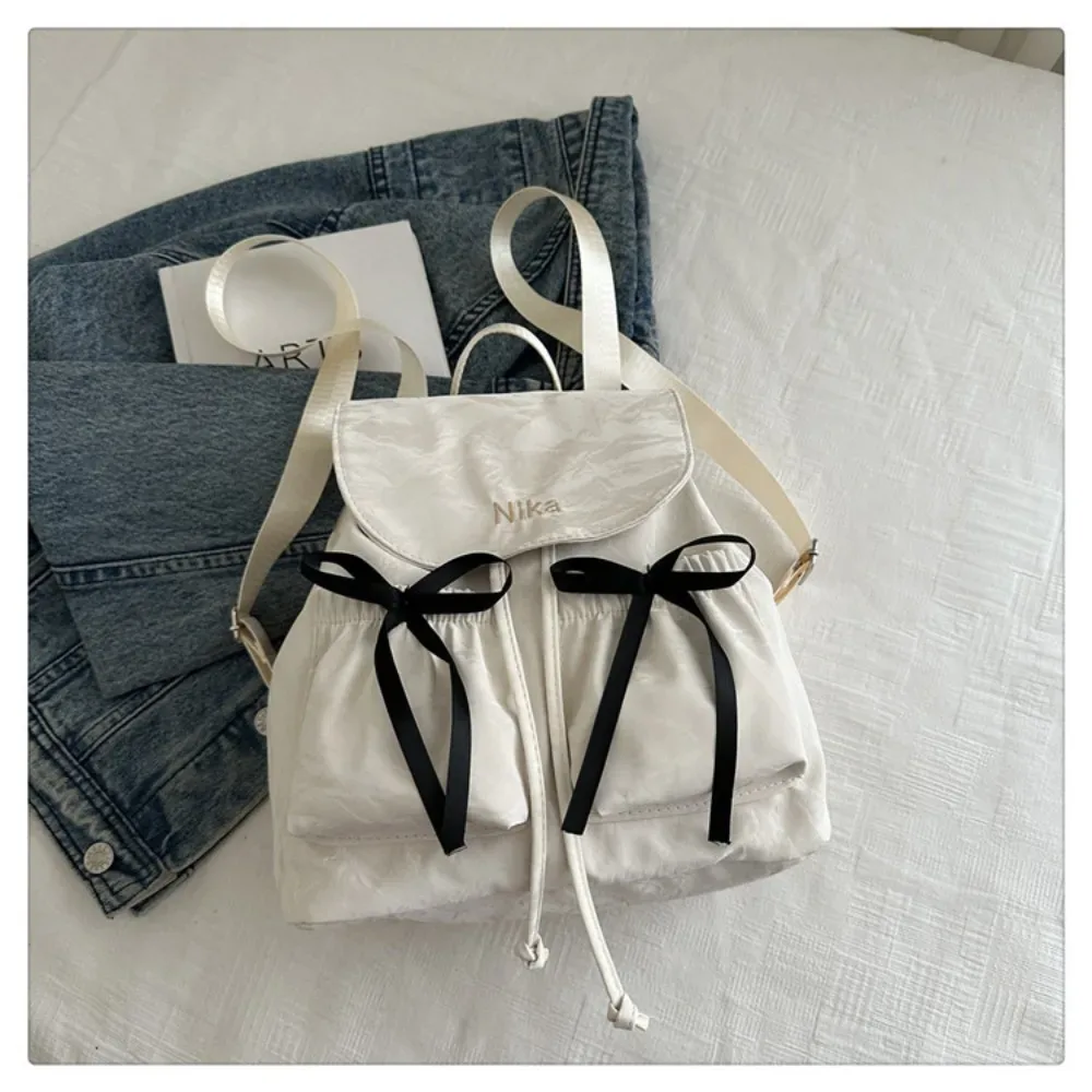 sac à dos à nœud mignon pour femmes, sac à dos avec cordon de serrage de grande capacité pour étudiants, sac de voyage de couleur unie pour l'extérieur