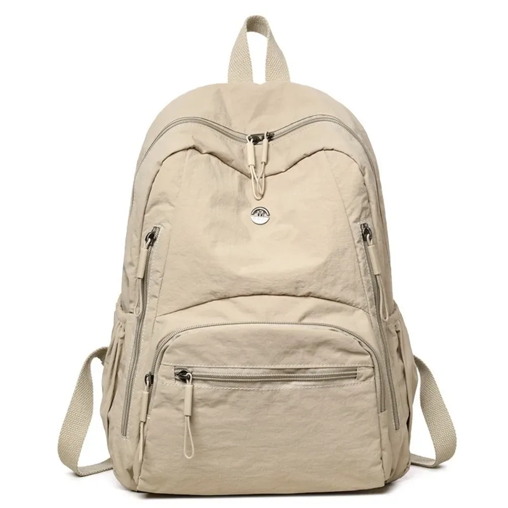 sac à dos minimaliste en nylon de grande capacité, léger, avec fermeture éclair sécurisée, sac à dos durable et imperméable pour l'école et l'utilisation quotidienne.