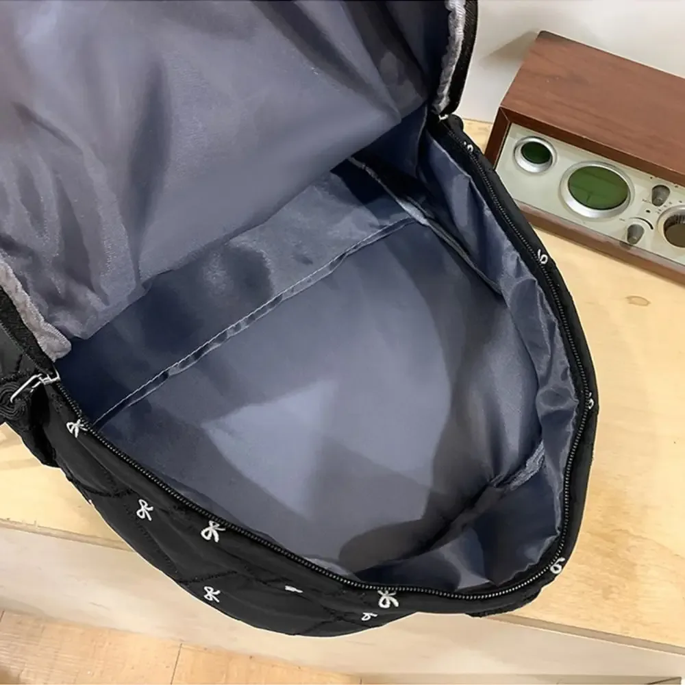 sac à dos léger en nylon avec nœud brodé, style preppy, sac à dos portable pour étudiants, idéal pour l'école et les activités de plein air.