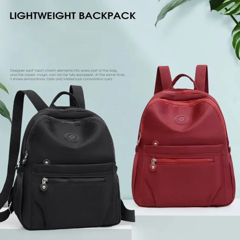 Sac à dos en Nylon de couleur unie, sac d'école de voyage léger, sac à dos de mode pour le travail, sac de voyage peut être accroché dans les bagages