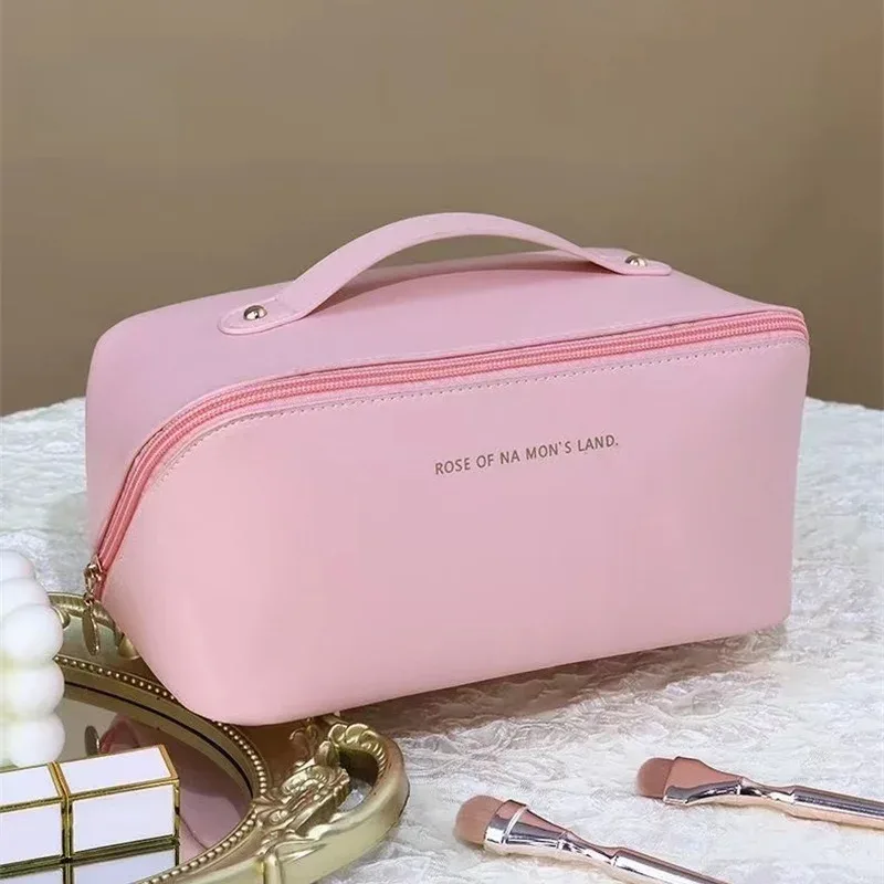sac de maquillage pratique à la mode, sac de rangement de voyage en pu, trousse de toilette de grande capacité, sac de maquillage pour oreiller de beauté stimulant les mains