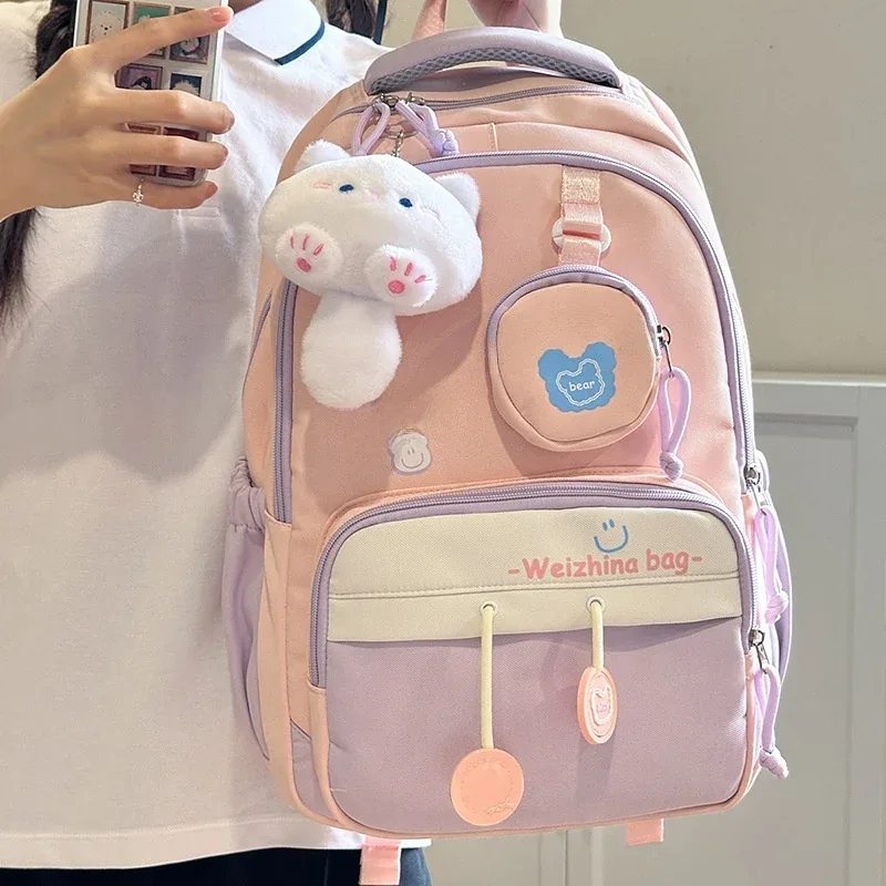 nouveau sac à dos de couleur contrastée de grande capacité pour les élèves du secondaire et du secondaire sac à bandoulière double mignon pour femmes matériau en nylon...