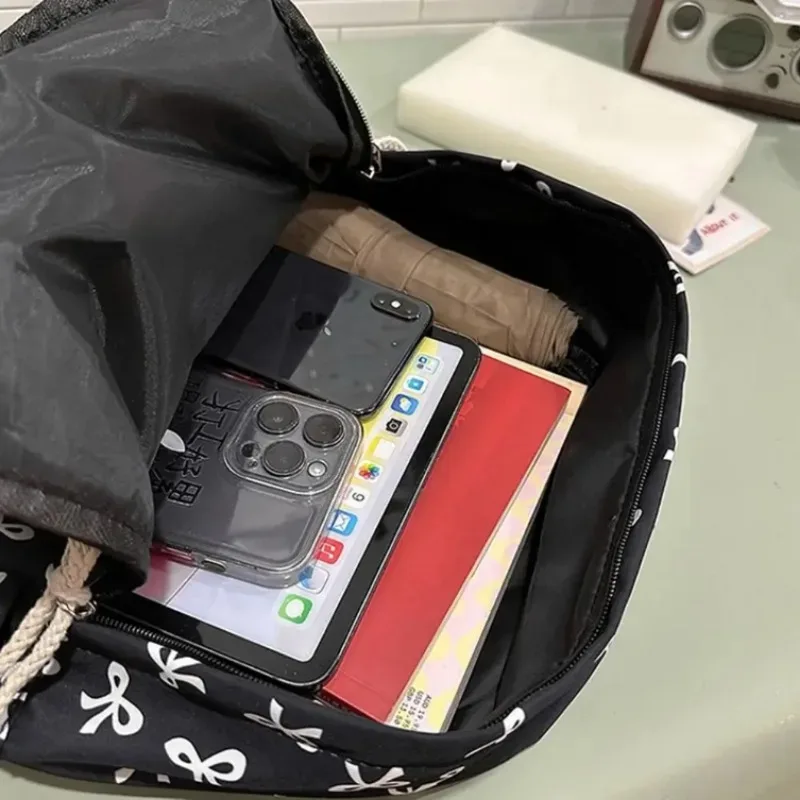 sac à dos tendance et mignon à imprimé nœud pour femme, compartiment pour ordinateur portable avec bretelles réglables, sac idéal pour la rentrée scolaire et les voyages sur le campus