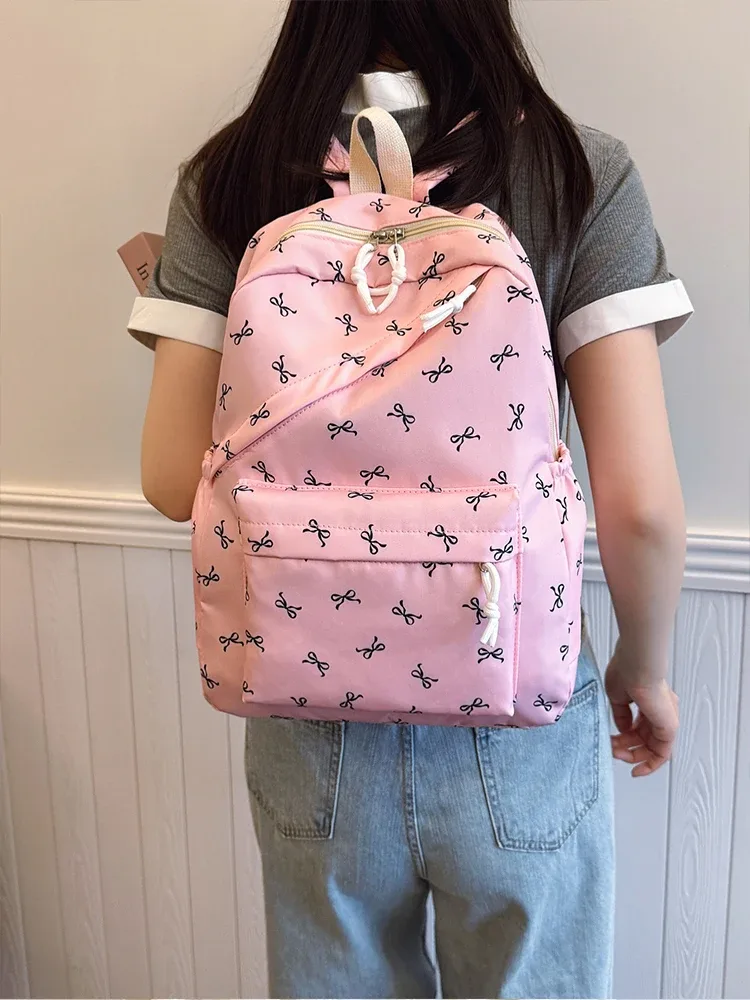 sac à dos tendance et mignon avec imprimé de nœuds, sac à dos pour ordinateur portable avec protection pour ordinateur portable, bretelles réglables, sac à dos pour ordinateur portable pour la rentrée scolaire.