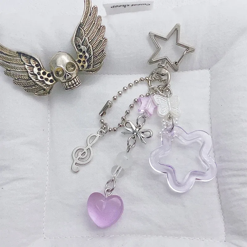 charmant porte-clés avec nœud en forme d'étoile et de cœur, parfait pour les femmes ; clé de voiture pour filles, cadeaux de décoration pour sac à dos