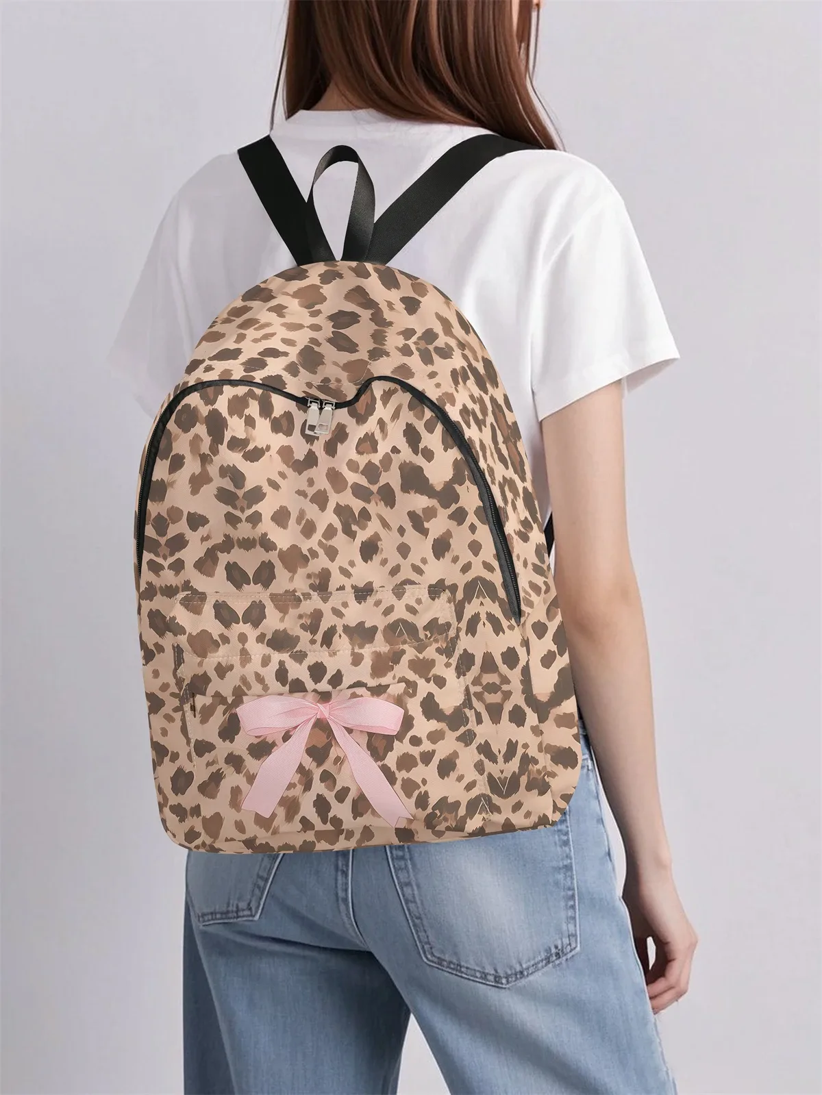 Sac à dos à motif léopard et nœud, nouveau modèle 2025, sac à dos de voyage décontracté, léger et simple.
