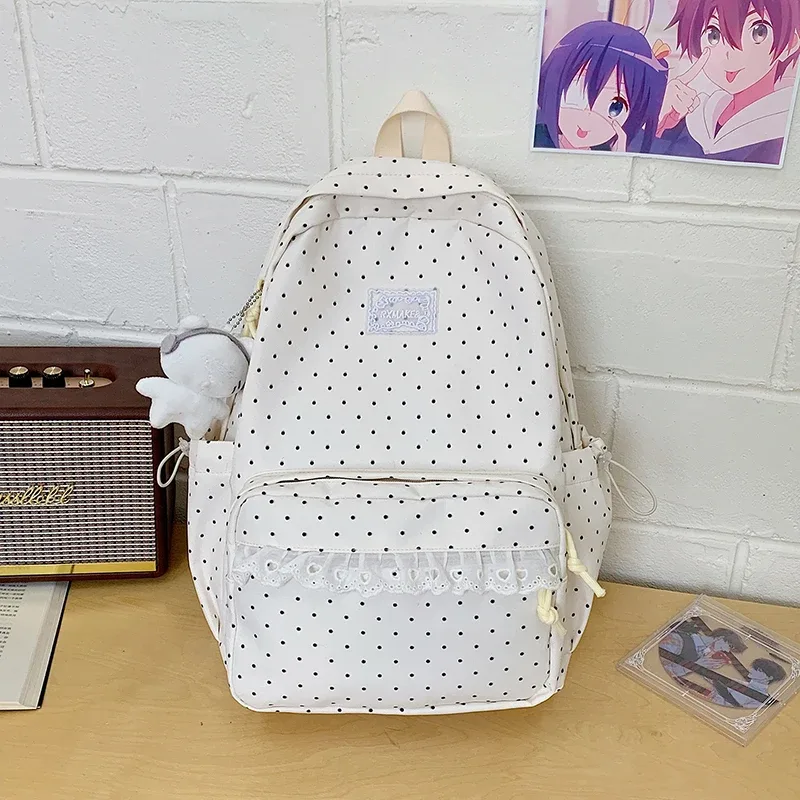 sac à dos tendance, sac d'école pour femmes à pois avec bordure en dentelle, mignon et élégant, sac à dos léger et de grande capacité pour étudiantes coréennes.