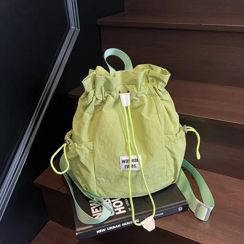 Sac en toile polyvalent de grande capacité, décontracté, nouvelle mode d'été 2025, sac à dos à cordon de serrage, concis, couleur unie, sacs d'école légers