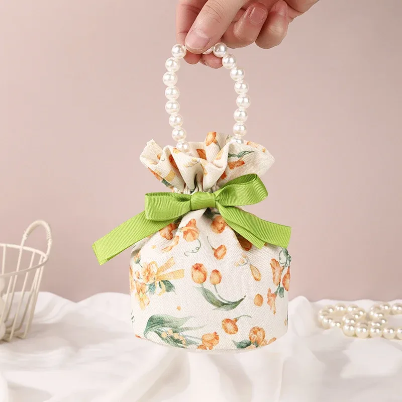 sac à cordon en toile florale, petite pochette à bijoux avec nœud papillon avec poignée en chaîne de perles, sac d'emballage de bonbons de mariage