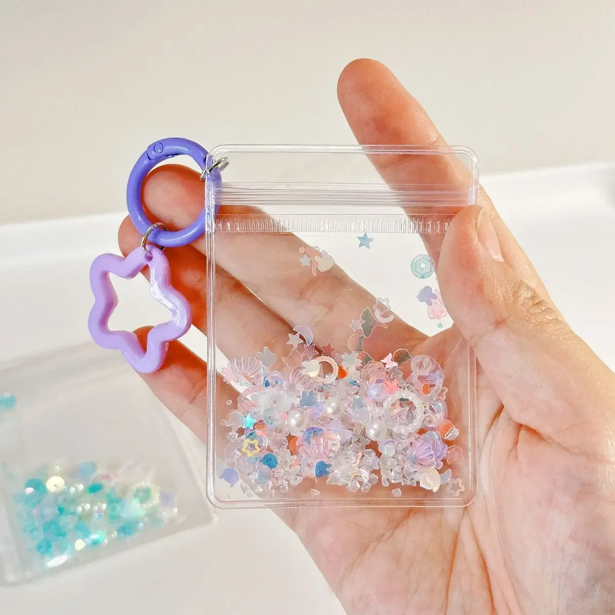 porte-clés mignon et tendance, mini sac de rangement transparent en forme d'étoile à cinq branches pour femme, pendentif pour sac et clés de voiture