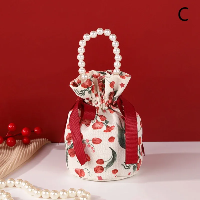 sac à cordon en toile florale, petite pochette à bijoux avec nœud papillon avec poignée en chaîne de perles, sac d'emballage de bonbons de mariage