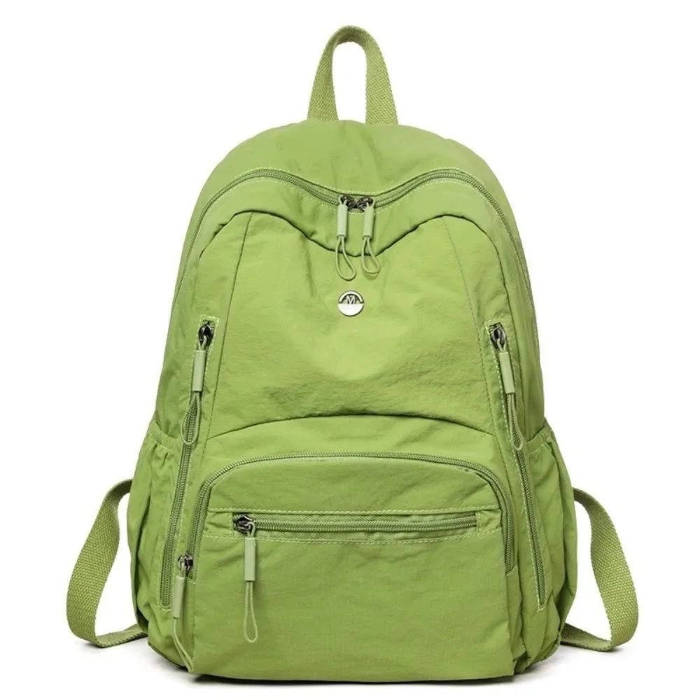 sac à dos minimaliste en nylon de grande capacité, léger, avec fermeture éclair sécurisée, sac à dos durable et imperméable pour l'école et l'utilisation quotidienne.