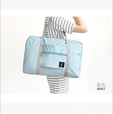 trave femmes sac en plein air hommes sacs pliant sac de rangement de voyage petit frais sacs de rangement de voyage pliable sac