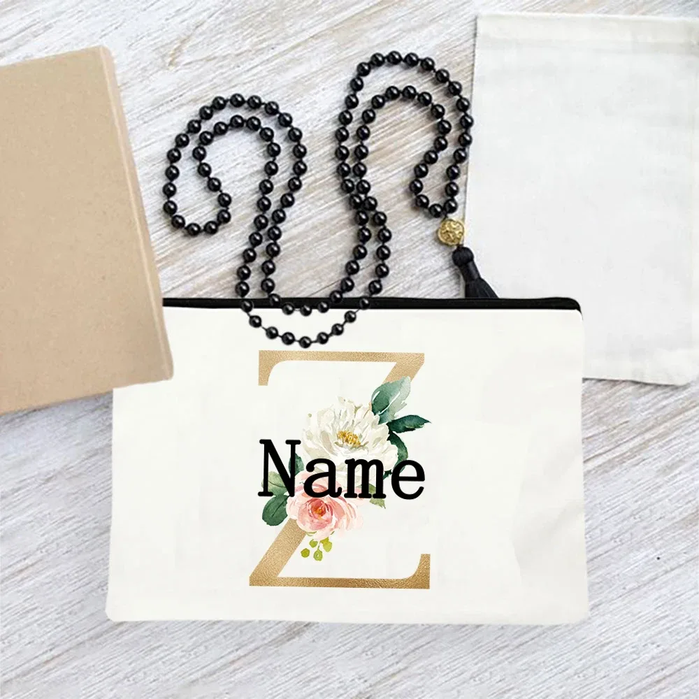 pochette en toile personnalisée avec initiales florales dorées, trousse de toilette légère personnalisée avec monogramme pour femmes, idéale pour les voyages quotidiens.