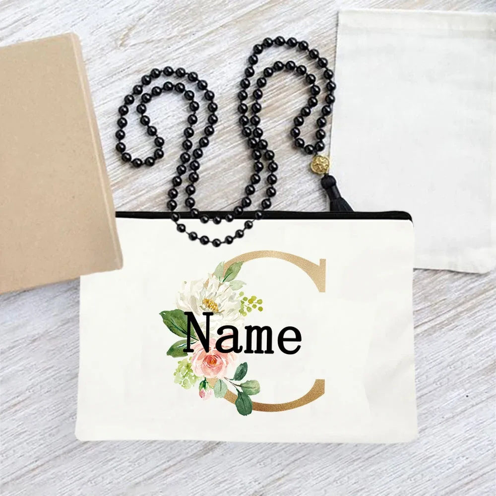 pochette en toile personnalisée avec initiales florales dorées, trousse de toilette légère personnalisée avec monogramme pour femmes, idéale pour les voyages quotidiens.