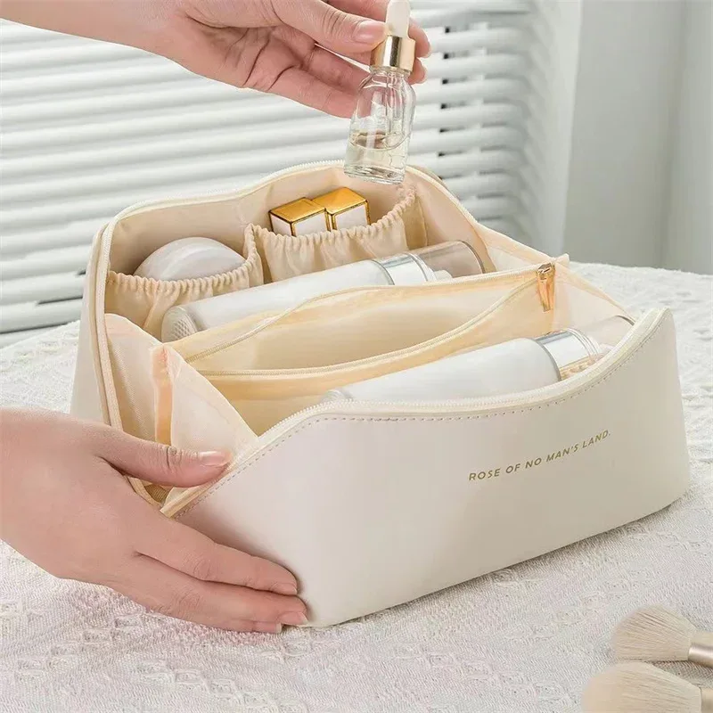 sac de maquillage pratique à la mode, sac de rangement de voyage en pu, trousse de toilette de grande capacité, sac de maquillage pour oreiller de beauté stimulant les mains