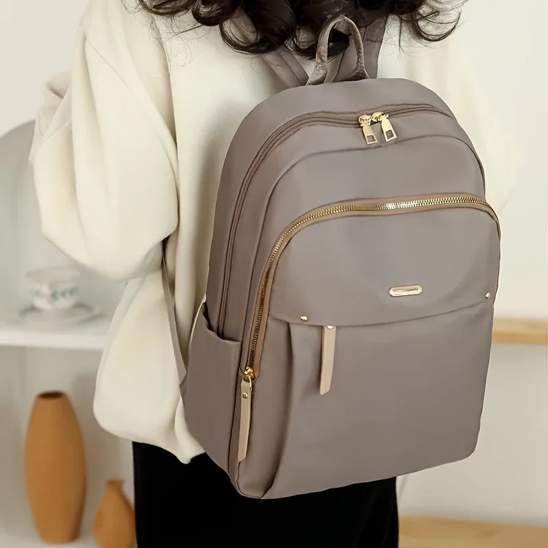 Sac à dos en nylon imperméable pour femmes, sac à dos d'école léger, sac à dos de voyage multi-poches, sac à dos élégant pour les loisirs avec fermeture éclair dorée