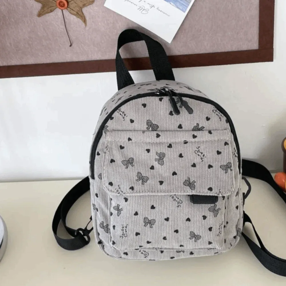mini sac à dos en velours côtelé avec imprimé cœur et nœud, sac à bandoulière multi-compartiments, ouverture zippée, sac à dos décontracté léger pour l'école